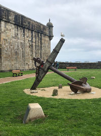 Old ruins on field against sky