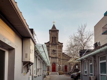 View of buildings in city against sky