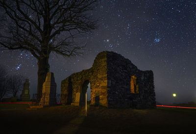 Old building against sky at night