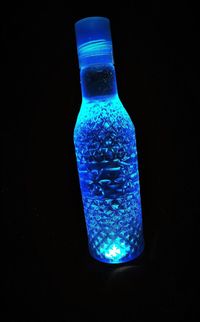 Close-up of water bottle against black background