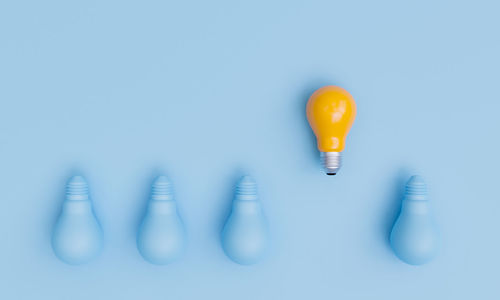 Blue and yellow bulb on table