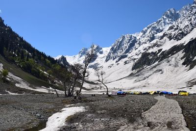 Scenic view of mountains against clear blue sky