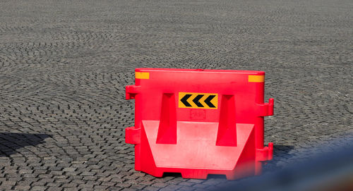 High angle view of arrow sign on street in city