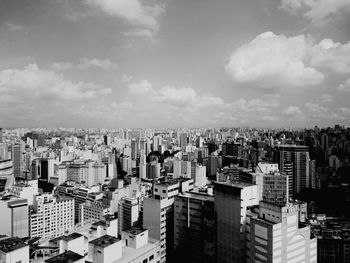 High angle view of buildings against sky in city