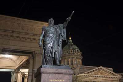 Low angle view of statue at night