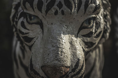 Close-up of statue against gray background