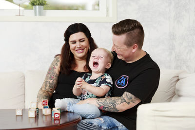 Mothers with toddler son in living room