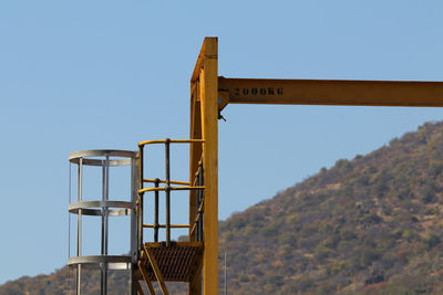 Low angle view of metallic structure against clear sky