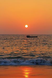 Scenic view of sea at sunset