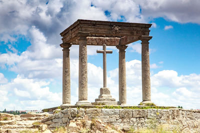 Low angle view of historical building against cloudy sky