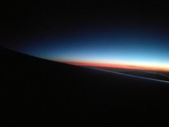 View of landscape against clear sky at night