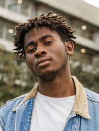 Portrait of young man standing outdoors