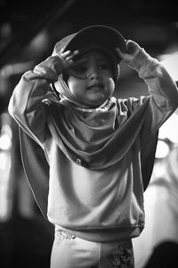 Portrait of little girl posing cute wearing hat black and white