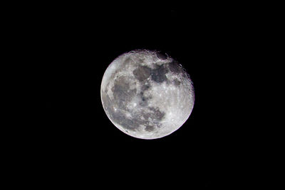 Low angle view of moon against clear sky at night