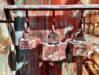 Close-up of rusty metal on wooden surface