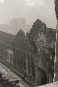 High angle view of old building in city against sky