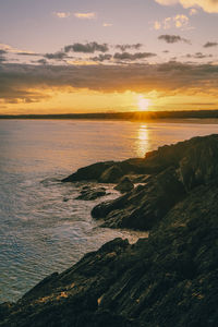 Scenic view of sea against sky during sunset