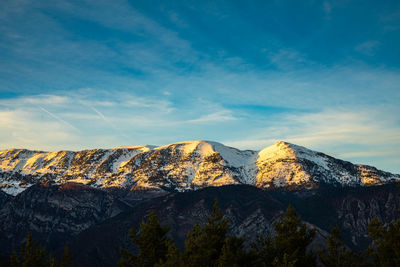 Scenic view of snowcapped mountains against sky