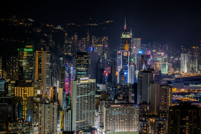 Aerial view of city lit up at night