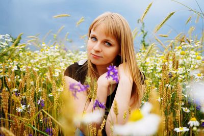 Portrait of beautiful woman amidst plants