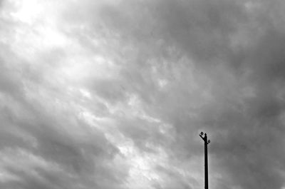 Low angle view of floodlight against sky