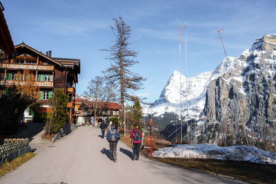 Panoramic view of road amidst trees against sky