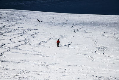 High angle view of person on snowcapped mountain