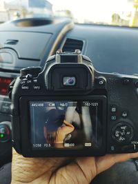 Close-up of digital camera in bus