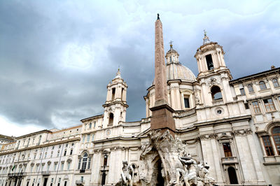 Low angle view of statue of building against sky