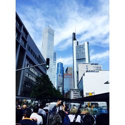 Buildings against cloudy sky