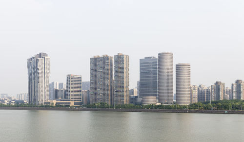 Modern buildings by qiantang river in hangzhou, china