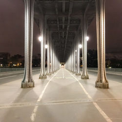 Illuminated bridge at night