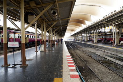 People waiting at railroad station platform