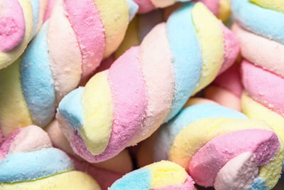 Background of twisted, colorful marshmallow, close up, macro