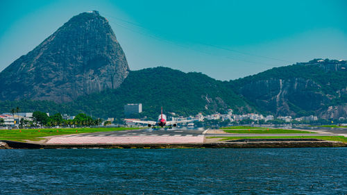 Commercial plane landing on the runway at santos dumont national airport.