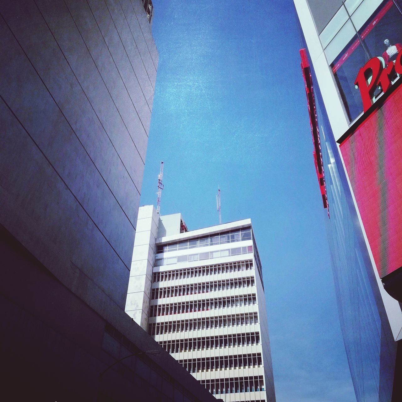 LOW ANGLE VIEW OF BUILDINGS AGAINST SKY