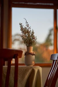 Close-up of native australian flowers sitting on rustic farmhouse table 