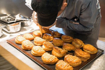 High angle view of man preparing food at store