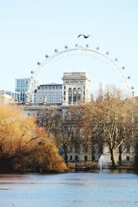 Buildings in city against clear sky