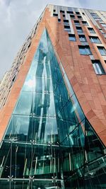 Low angle view of modern buildings against sky