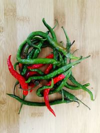 Close-up of red chili peppers on table