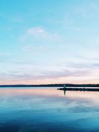 Scenic view of calm sea at sunset