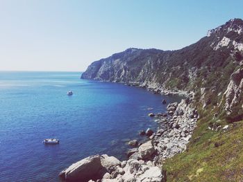 Scenic view of sea against blue sky