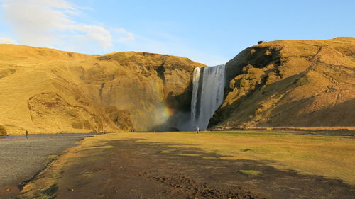 View of waterfall along rocks