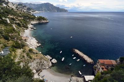 High angle view of mountain by sea