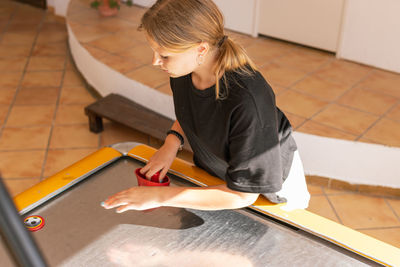 Side view of man working at home