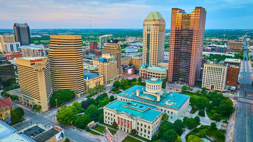 Buildings in city against sky