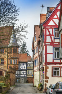 Street with historical half-timbered house in budingen, hesse, germany