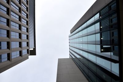 Low angle view of office building against sky