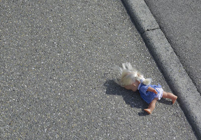 High angle view of doll on street